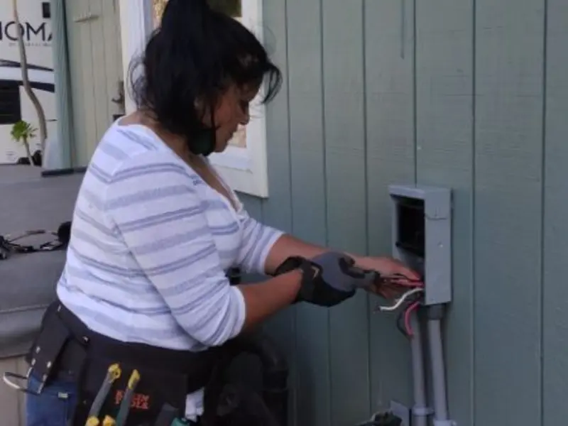Licensed electrician wiring an exterior subpanel in Wrightsboro
